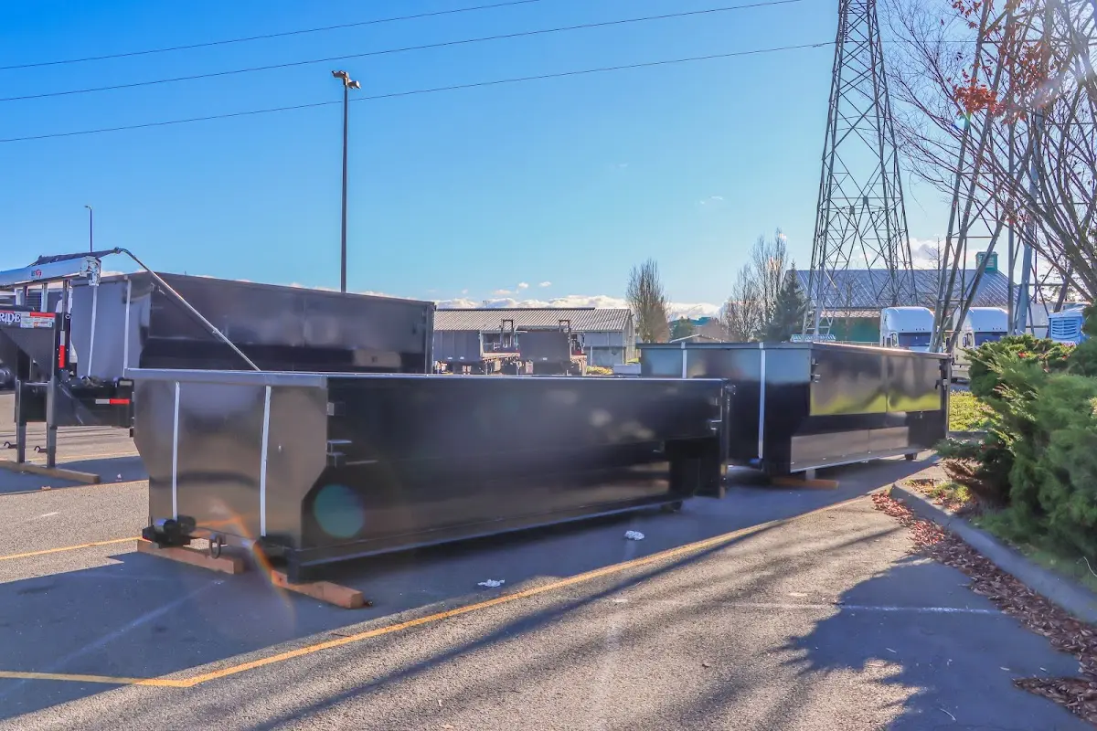 Roll-off dumpster ready for waste disposal at job site for Concrete Dumpster Rental in Walton